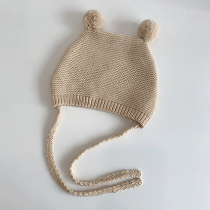 Bonnet Bébé d'Hiver à Pompons